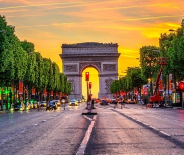 Champs-Elysees and Arc de Triomphe at night in Paris, France. Architecture and landmarks of Paris. Postcard of Paris