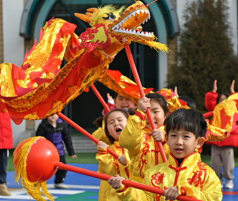 YANTAI, CHINA - JANUARY 16: Children perform dragon dance at a kindergarten ahead of the Chinese New Year, the Year of the Dragon, on January 16, 2024 in Yantai, Shandong Province of China. (Photo by Sun Wentan/VCG via Getty Images)